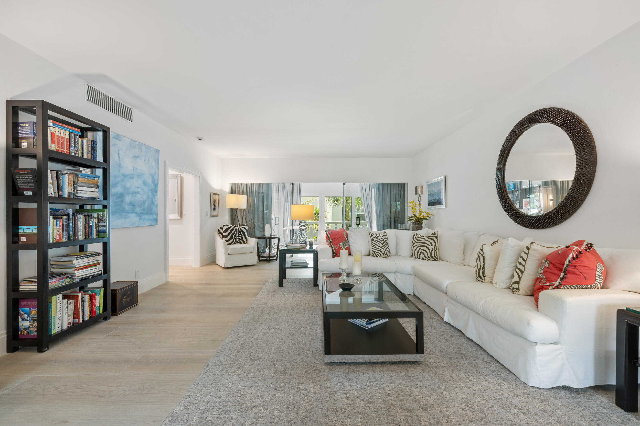 300 South Ocean Boulevard, Unit 3G Palm Beach, FL 33480 - Photo 3 of 25 a living room with furniture and a book shelf