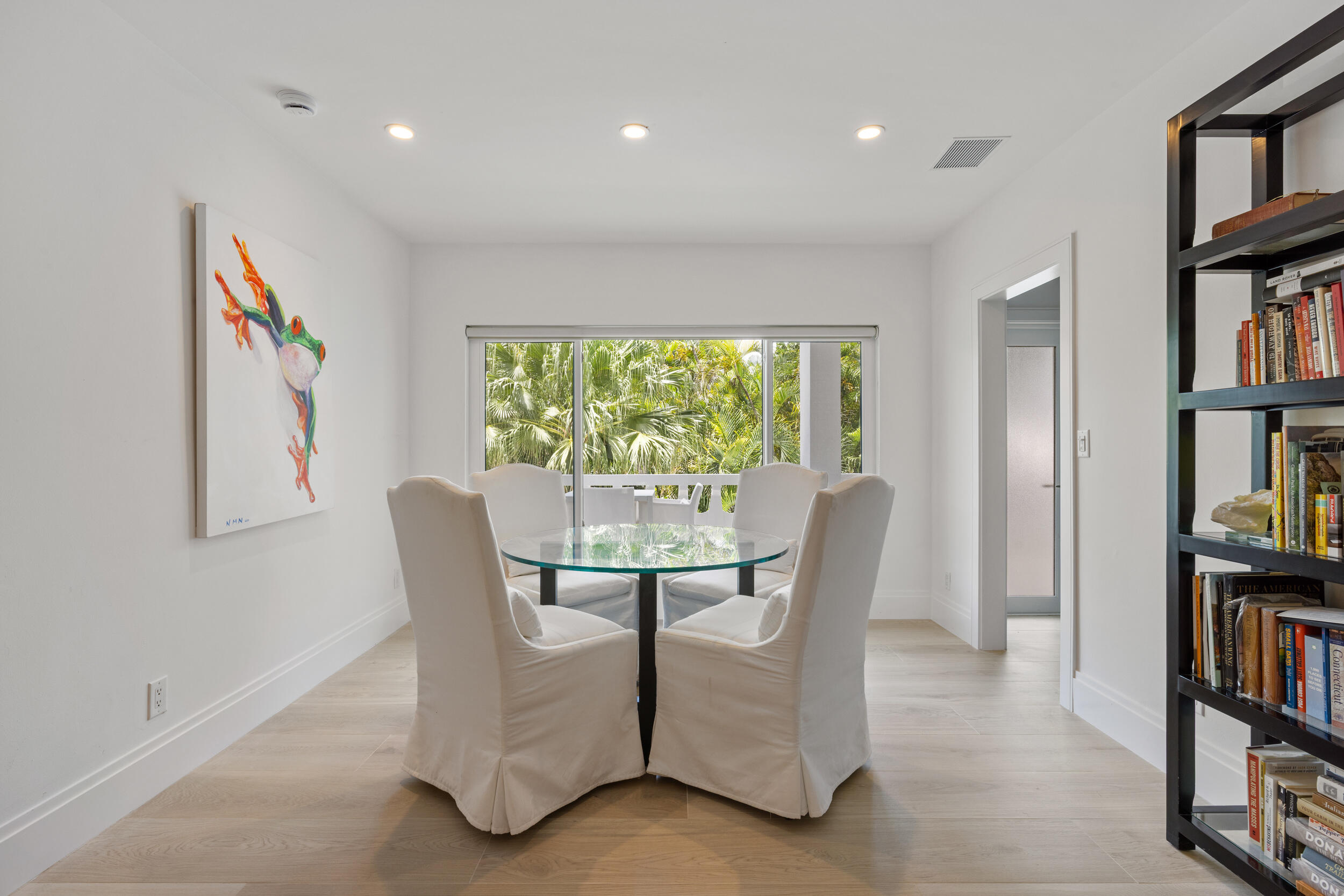 300 South Ocean Boulevard, Unit 3G Palm Beach, FL 33480 - Photo 6 of 25 a dining room with furniture and a book shelf