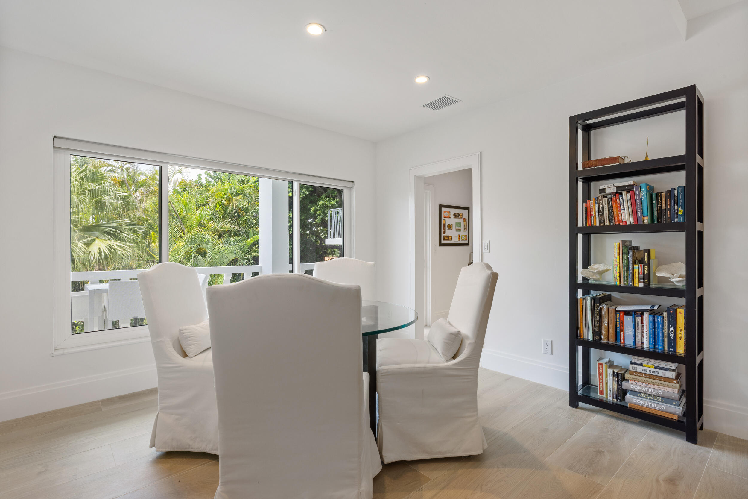 300 South Ocean Boulevard, Unit 3G Palm Beach, FL 33480 - Photo 7 of 25 a living room with furniture and a book shelf