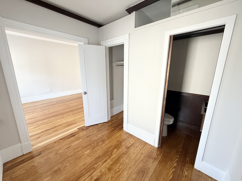 71 Saxton Street, Unit 2 Boston, MA 02125 - Photo 8 of 10 a view of front door with wooden floor