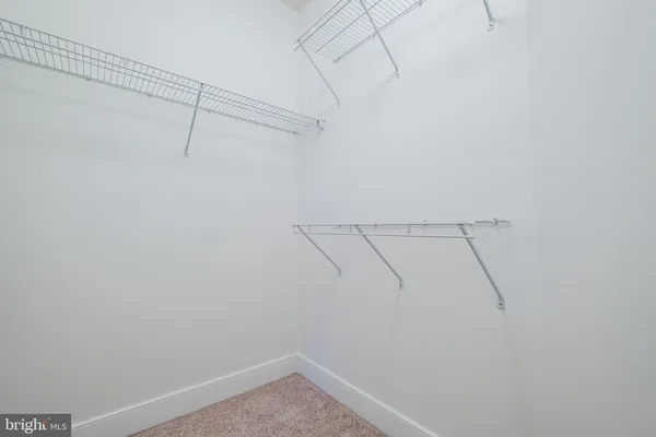 a bathroom with a granite countertop sink and a bathtub