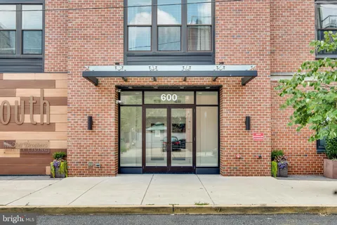 a view of a brick building with many windows