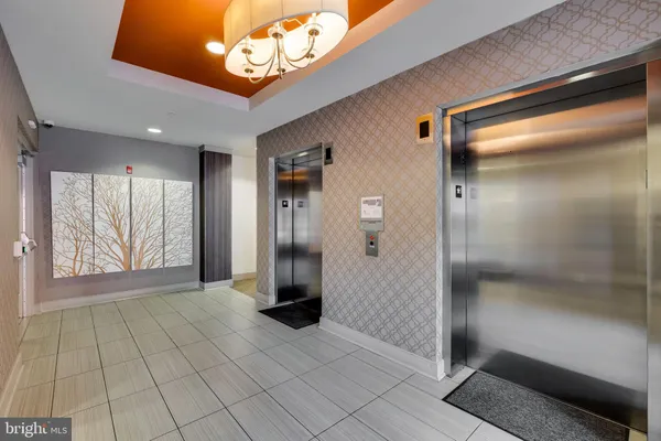 a bedroom with furniture and painting on the wall