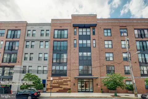 a car parked in front of a brick building