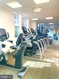 a room with a table and gym equipment