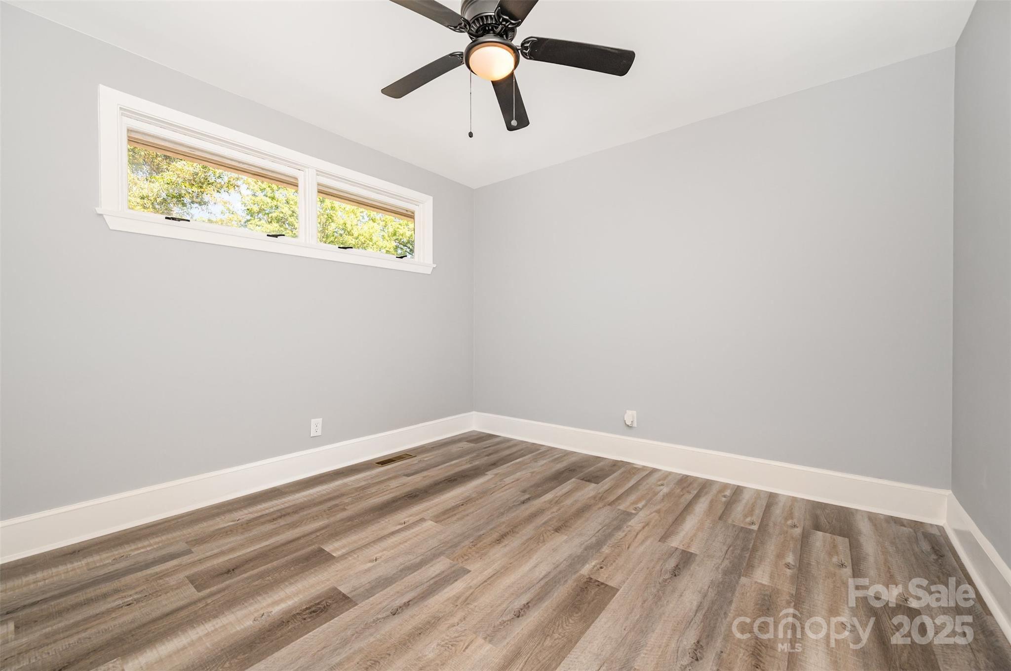 1015 Andover Road Charlotte, NC 28211 - Photo 20 of 22 wooden floor in an empty room with a window