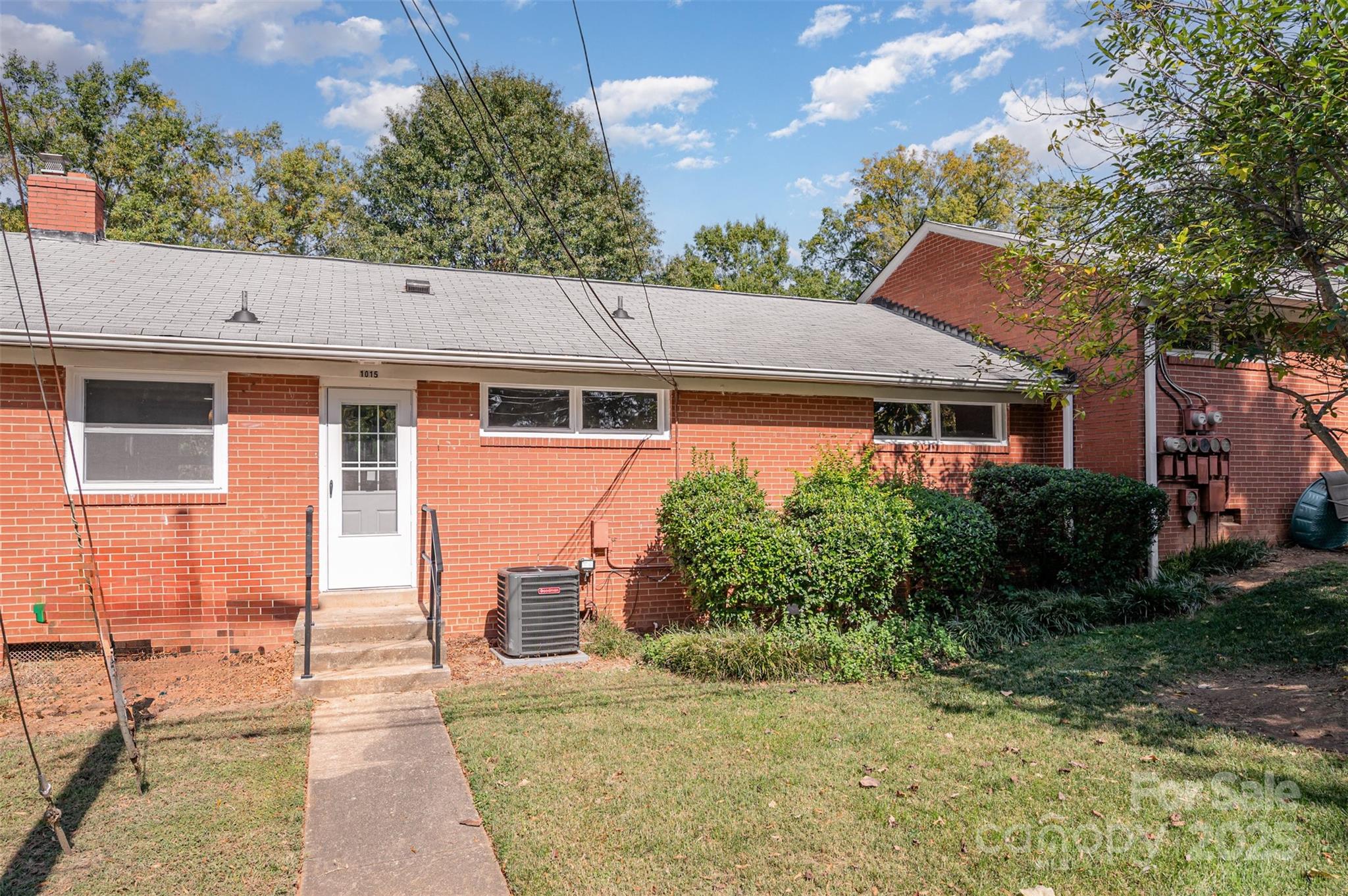 1015 Andover Road Charlotte, NC 28211 - Photo 21 of 22 a front view of a house with a yard garage and outdoor seating