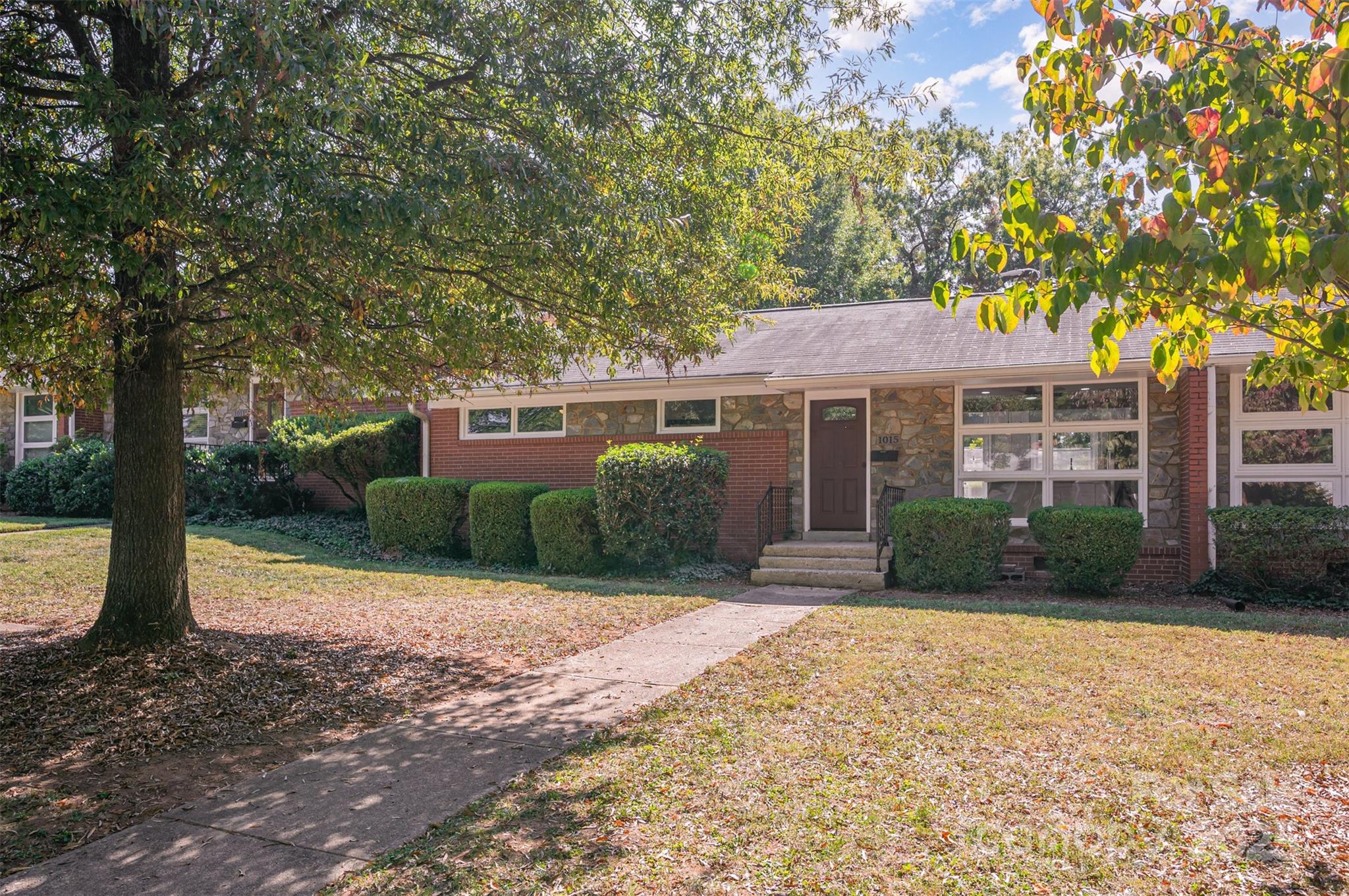 1015 Andover Road Charlotte, NC 28211 - Photo 3 of 22 a front view of a house with a garden