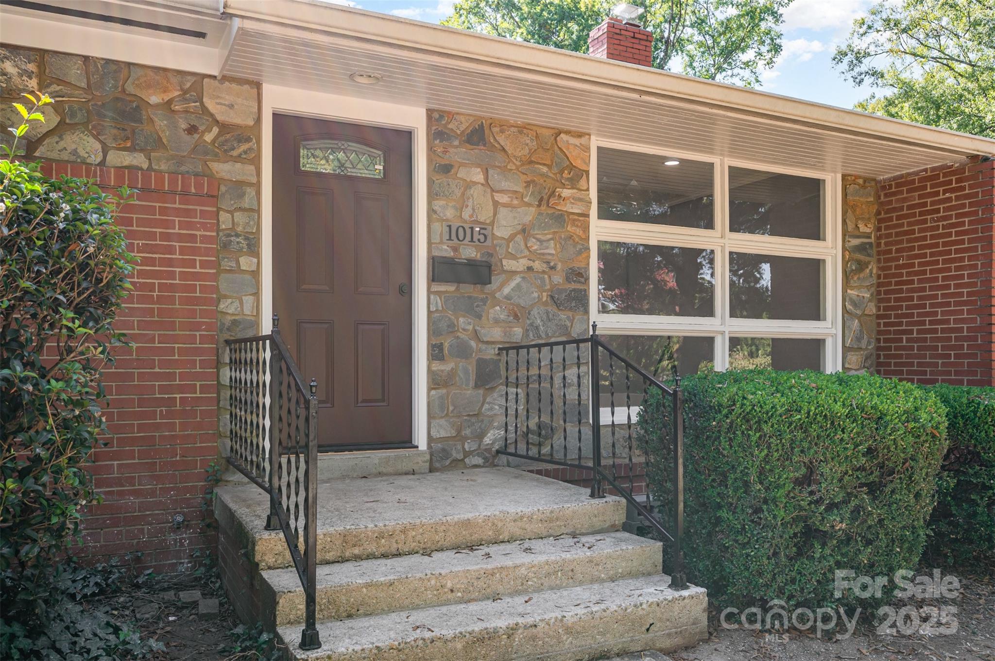 1015 Andover Road Charlotte, NC 28211 - Photo 5 of 22 a front view of a house with a yard