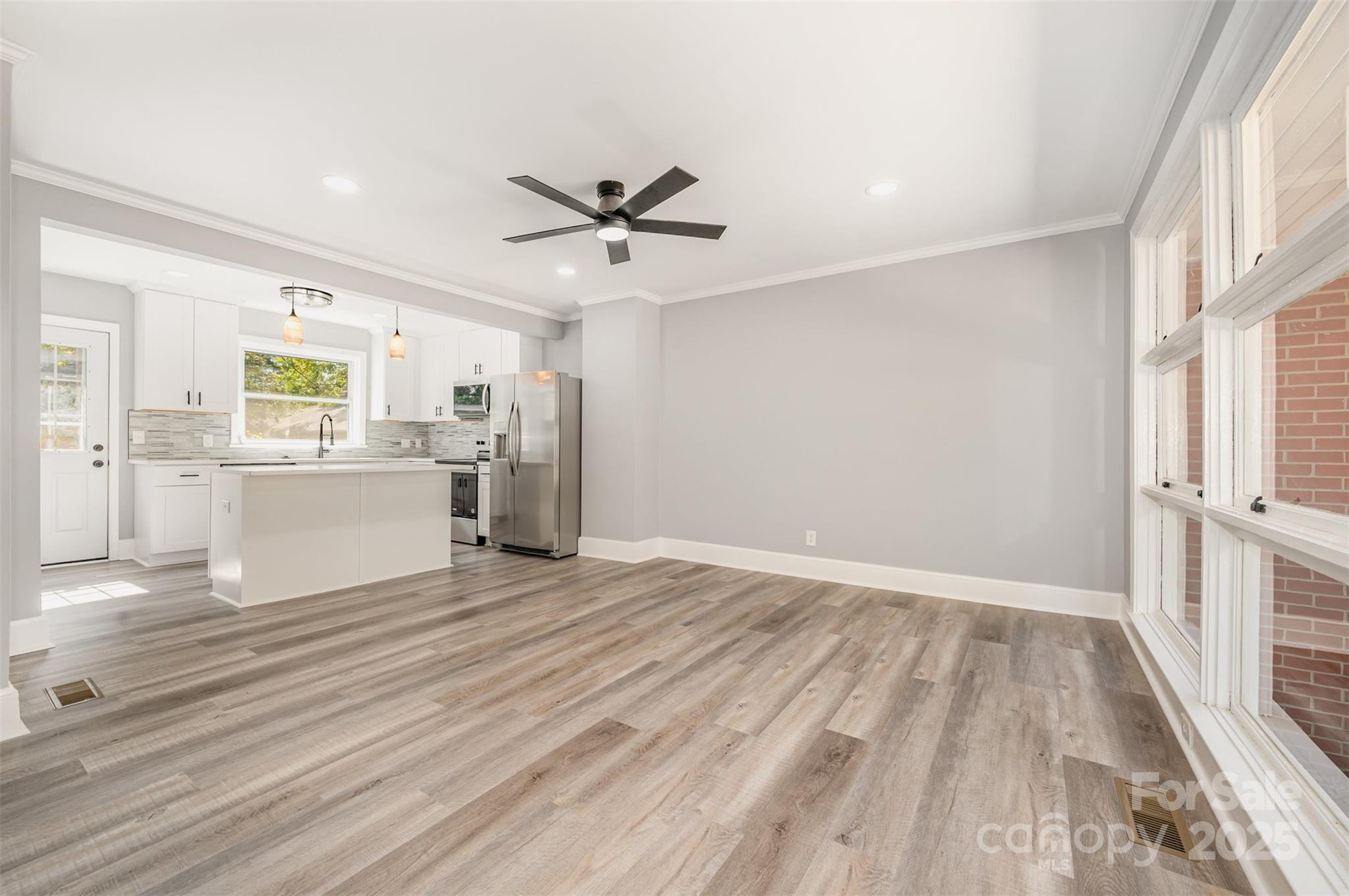 1015 Andover Road Charlotte, NC 28211 - Photo 8 of 22 wooden floor in an empty room with a window