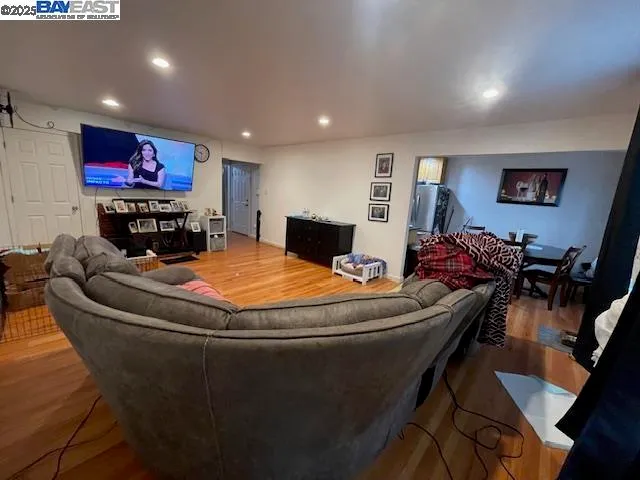 a room with furniture and a flat screen tv