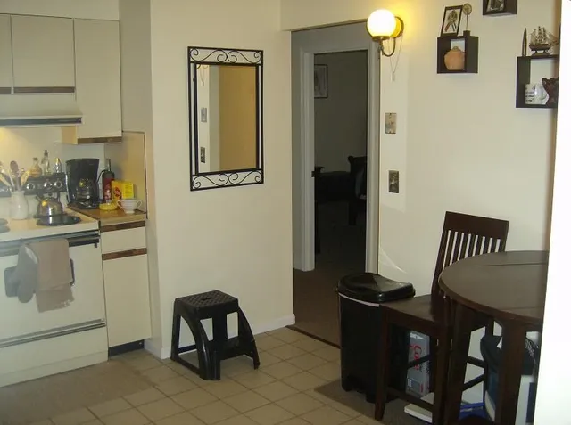 a bedroom with a bed and a television