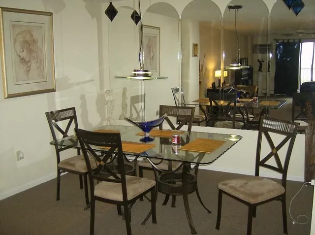 a view of a dining room with furniture