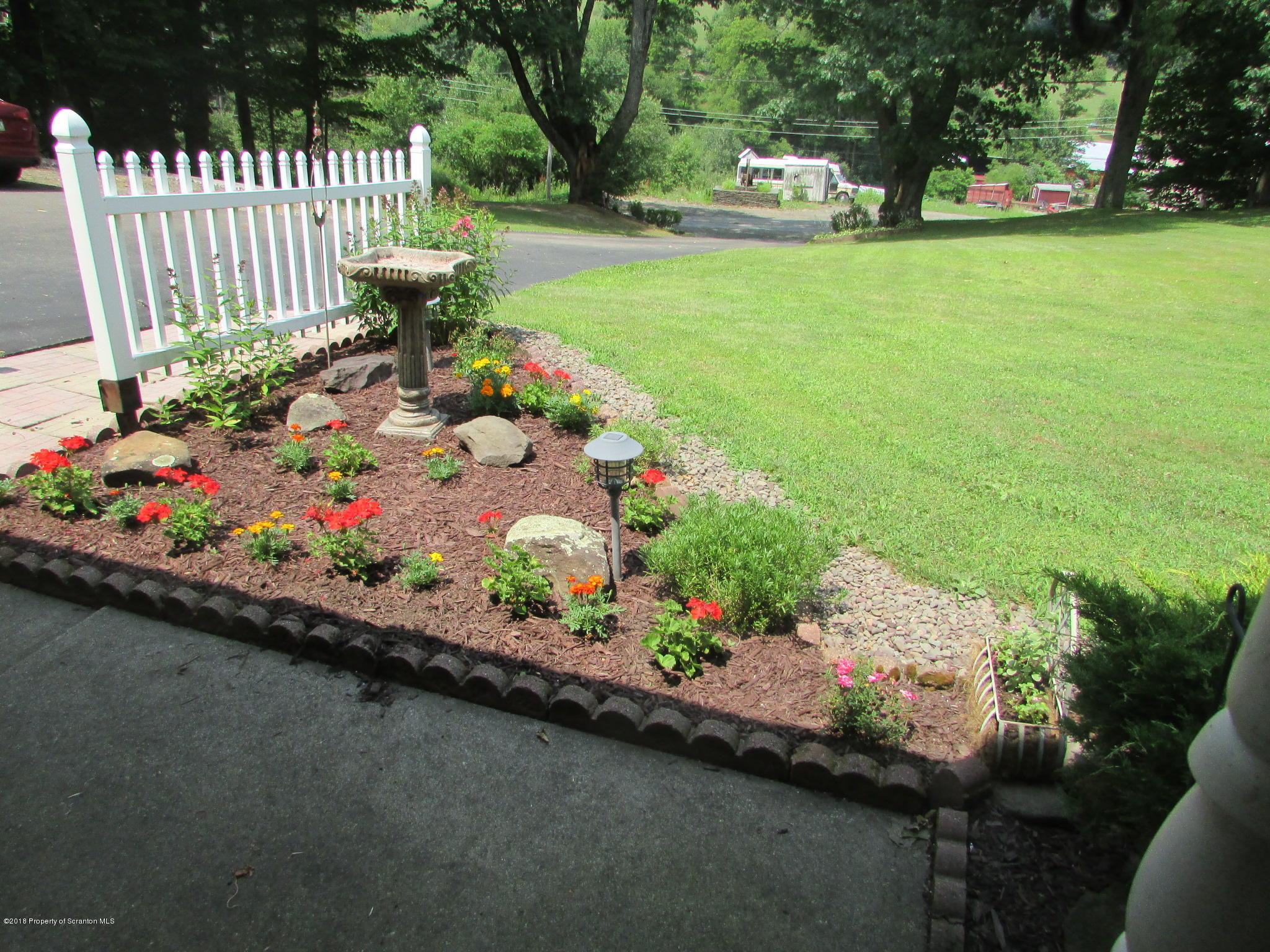 8840 State Rte 3001 Meshoppen, PA 18630 - Photo 64 of 64 a bunch of flowers are in a garden