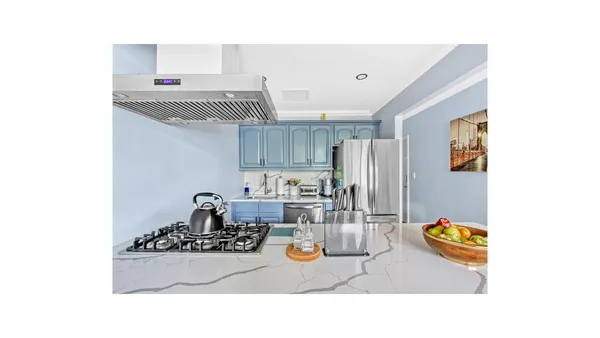a kitchen with a sink and appliances