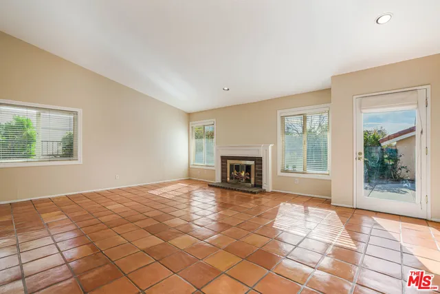 a view of empty room with windows