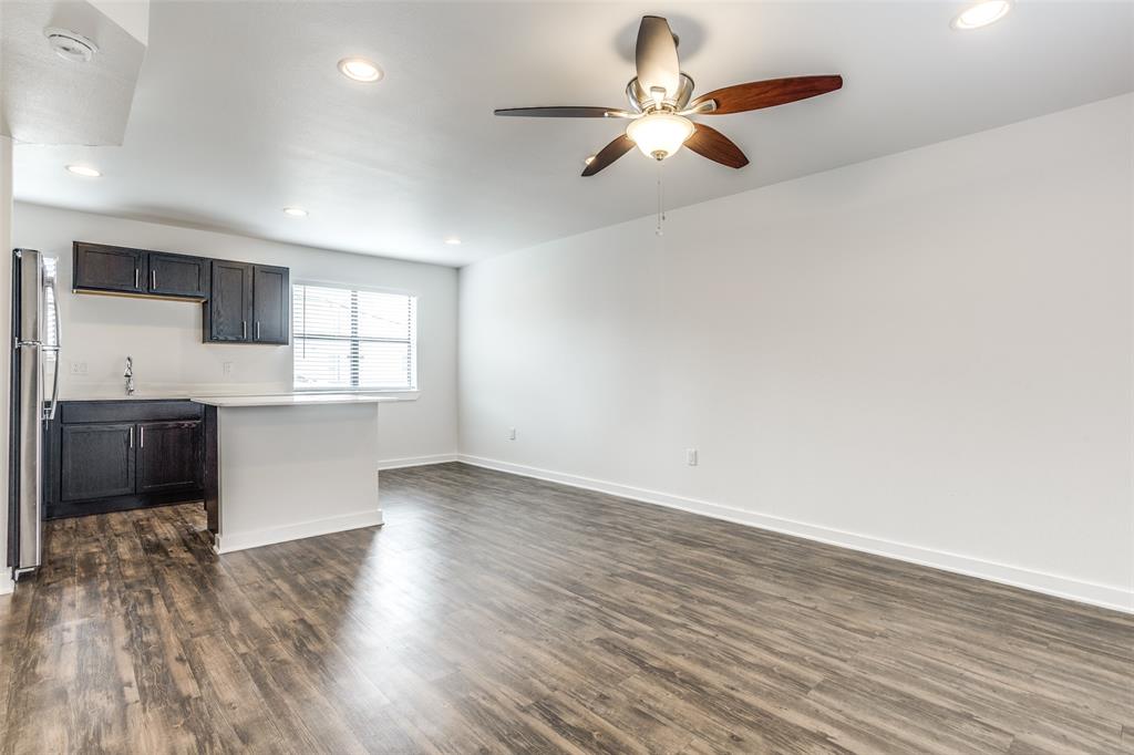 2106 Bennett Avenue, Unit 209 Dallas, TX 75206 - Photo 6 of 22 Open-concept living space featuring wood-finish flooring, recessed lighting, and a ceiling fan