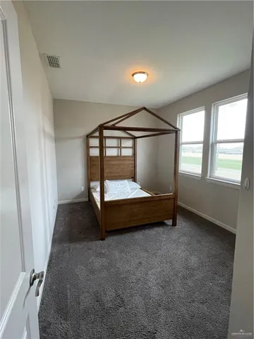 a bed room with a bed and a window