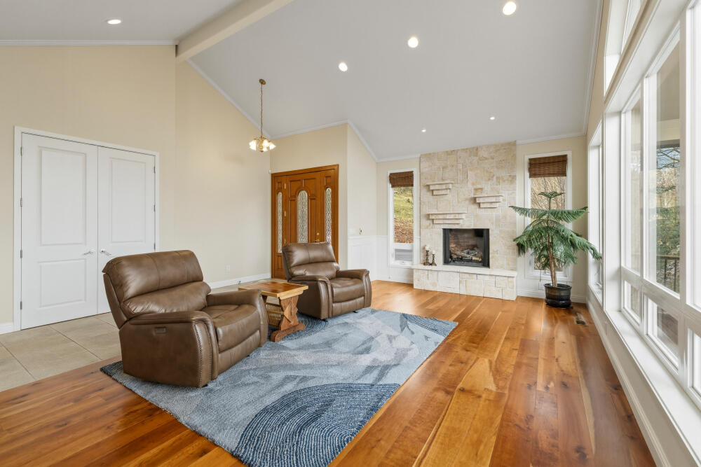 6586 Cooper's Hawk Road Klamath Falls, OR 97601 - Photo 11 of 68 a living room with furniture fireplace and window