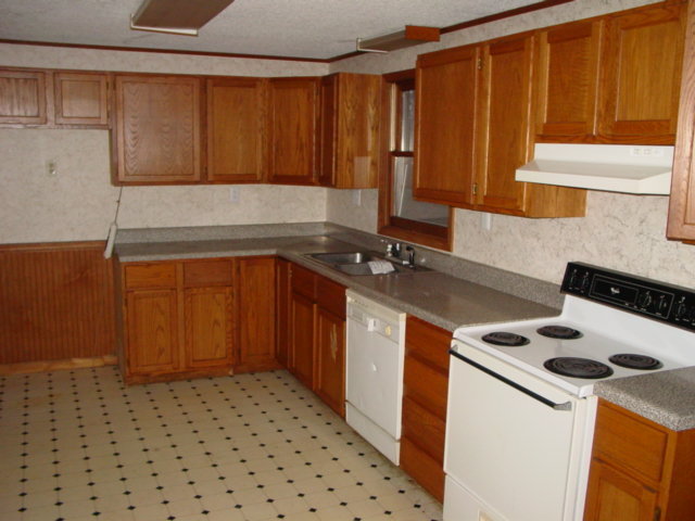 74 Arthur Road Roanoke, VA 24019 - Photo 5 of 11 a kitchen with a sink a stove cabinets and a counter top space
