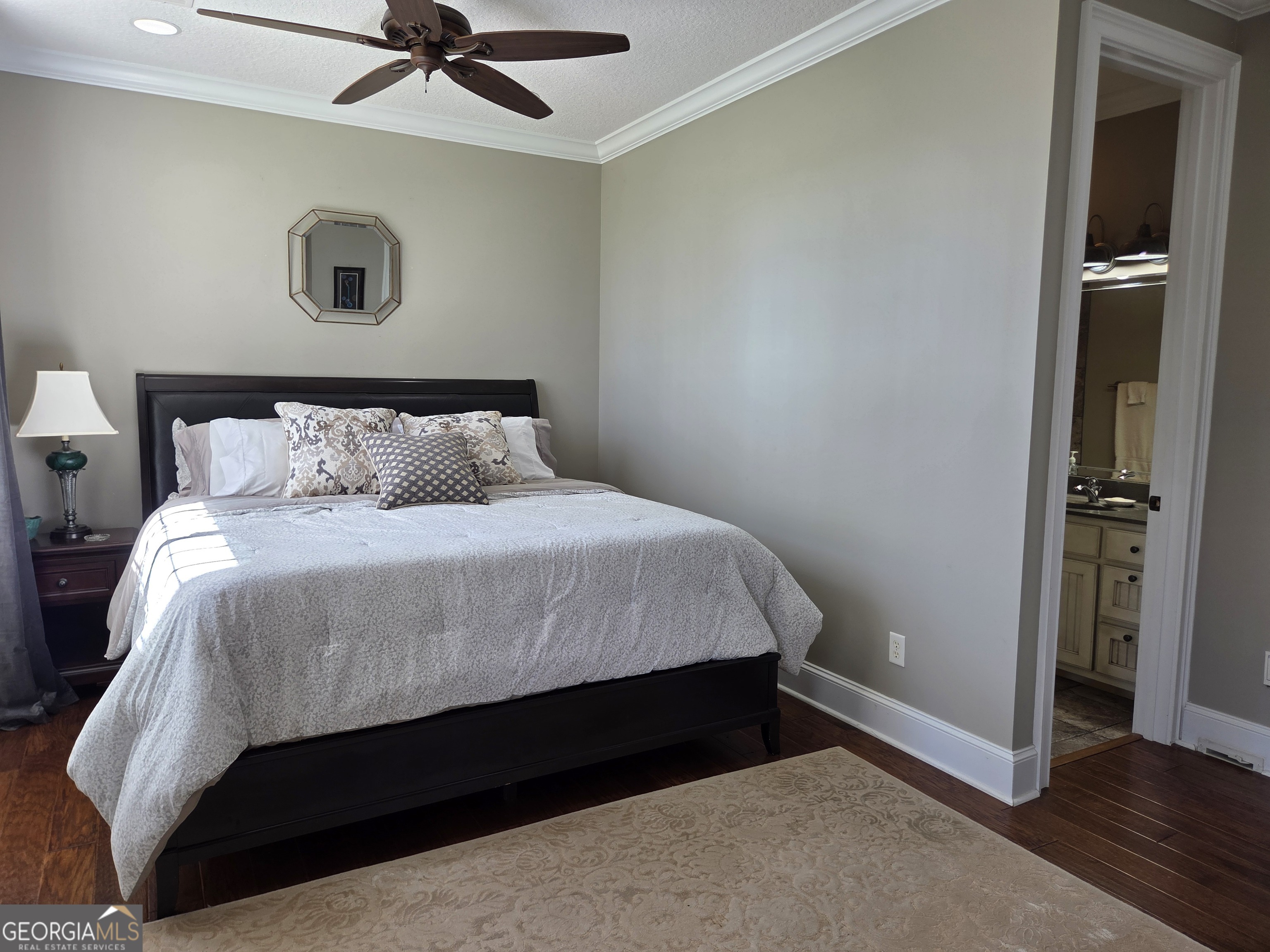 300 Hammond Powell Road Hazlehurst, GA 31539 - Photo 74 of 91 a bed room with a bed and a ceiling fan