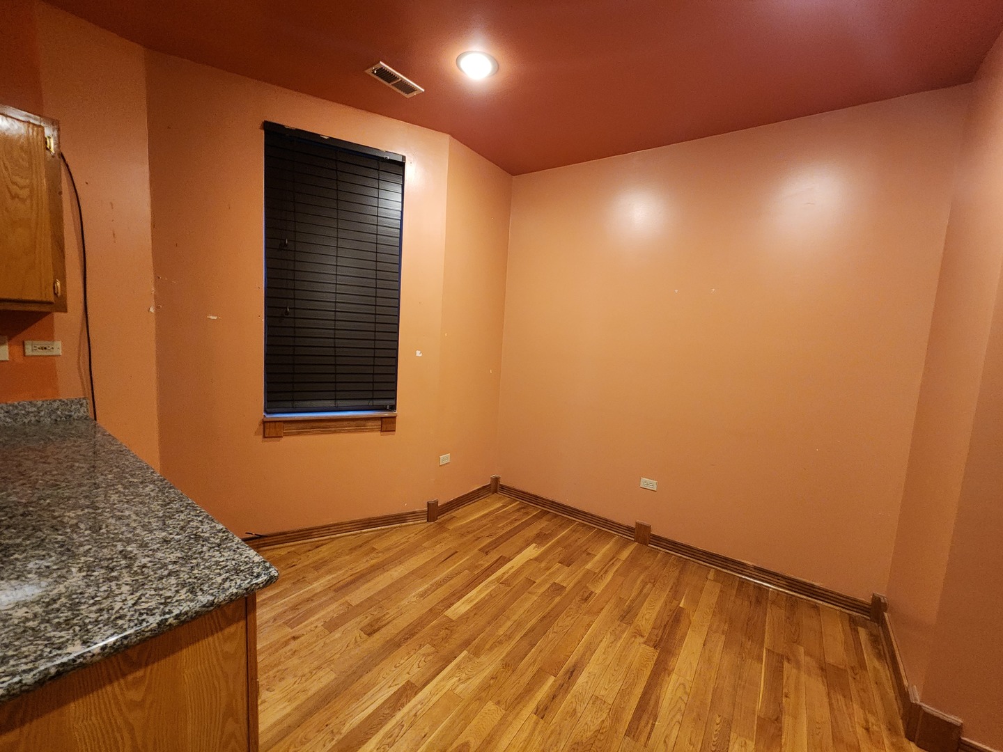 1756 West 35th Street, Unit 2R Chicago, IL 60609 - Photo 4 of 8 a view of an empty room with wooden floor and a window