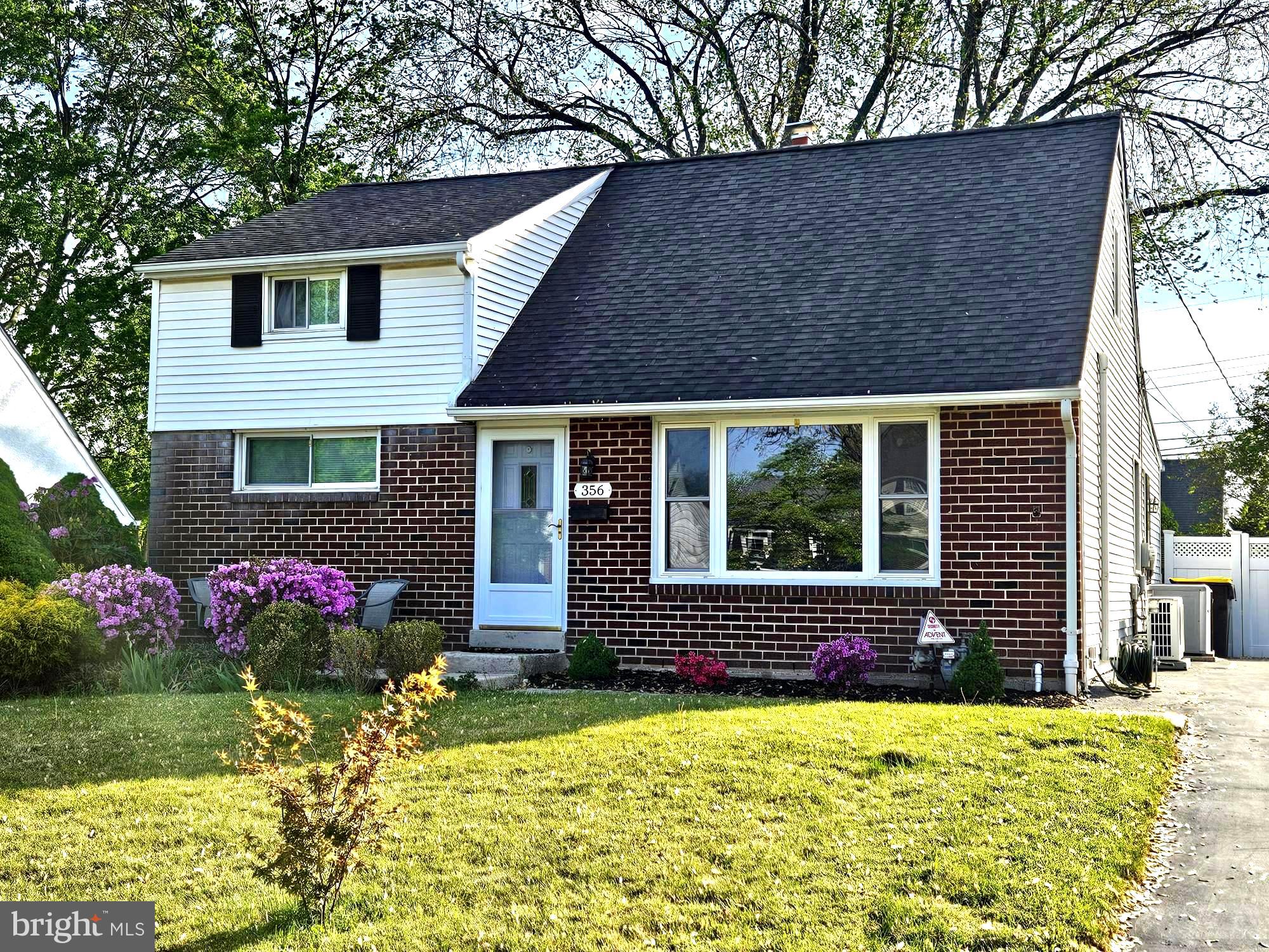 356 West Signal Hill Road King of Prussia, PA 19406 - Photo 1 of 28 a front view of house and yard with beautiful flowers and green space