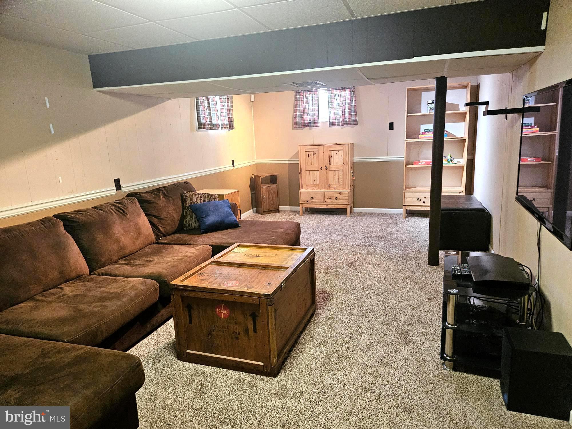 356 West Signal Hill Road King of Prussia, PA 19406 - Photo 19 of 28 a living room with furniture and a flat screen tv