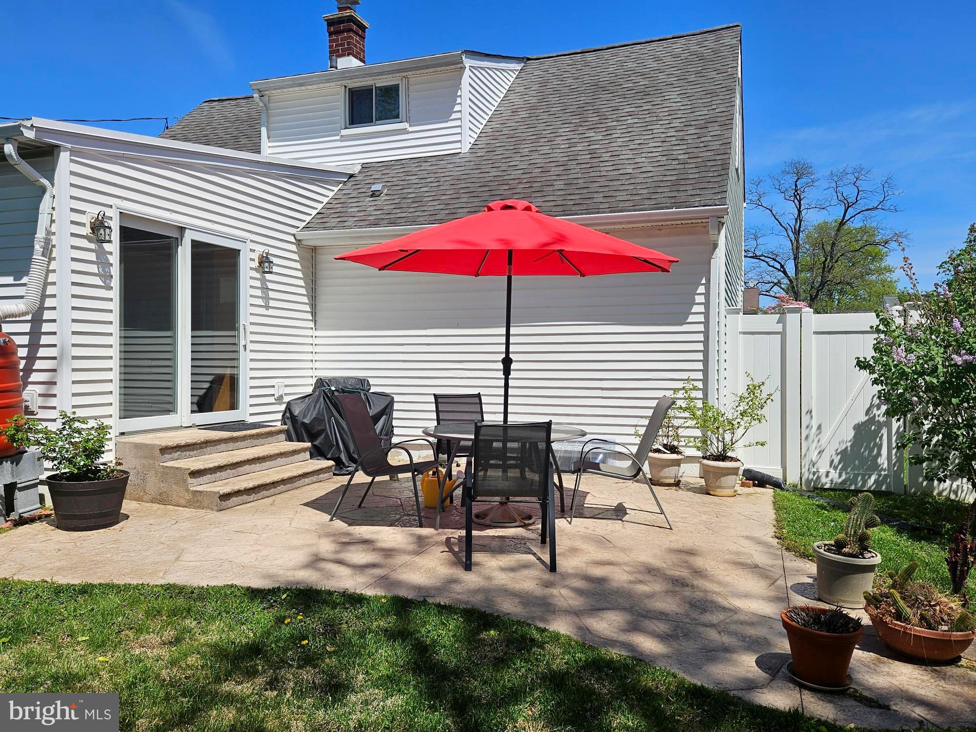 356 West Signal Hill Road King of Prussia, PA 19406 - Photo 24 of 28 a view of a patio with table and chairs under an umbrella