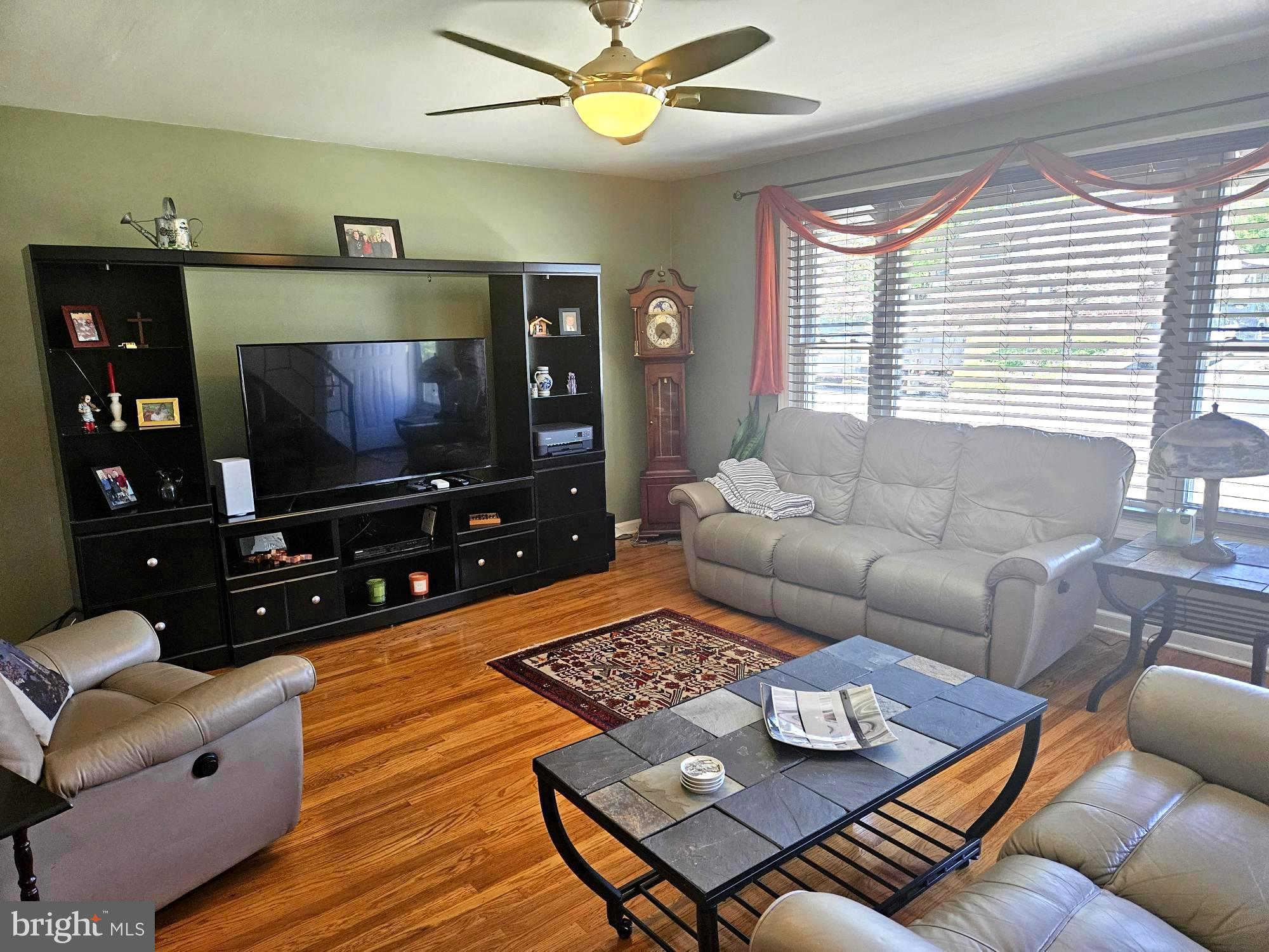 356 West Signal Hill Road King of Prussia, PA 19406 - Photo 4 of 28 a living room with furniture and a flat screen tv
