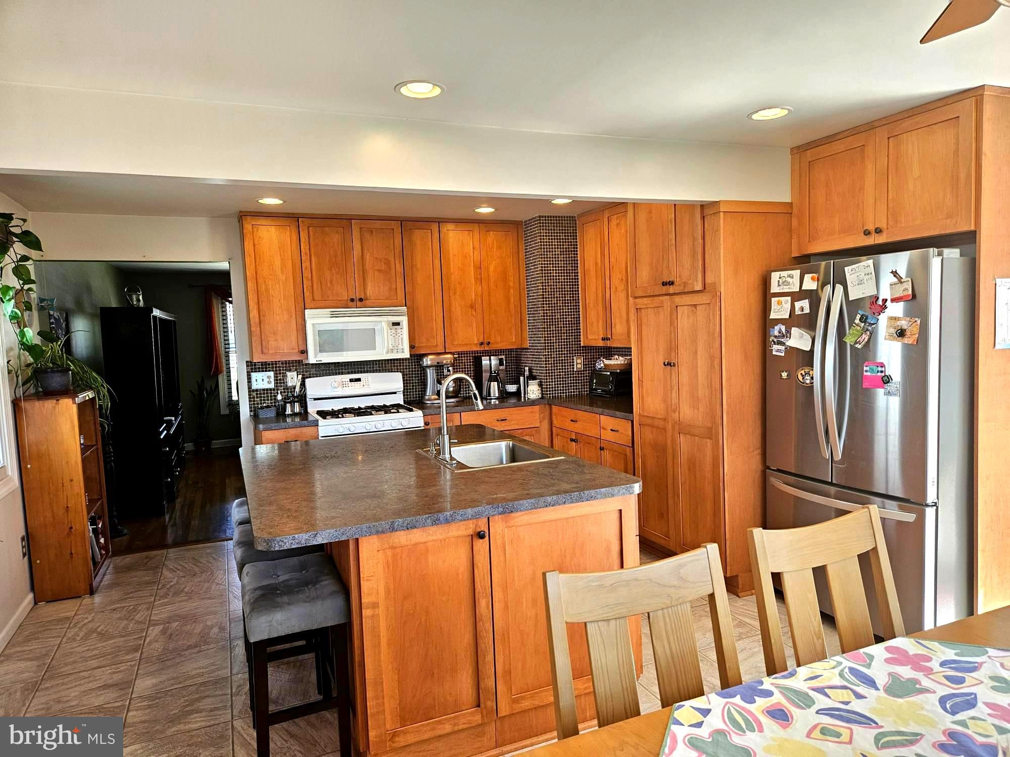 356 West Signal Hill Road King of Prussia, PA 19406 - Photo 7 of 28 a kitchen with stainless steel appliances granite countertop a refrigerator and a view of living room