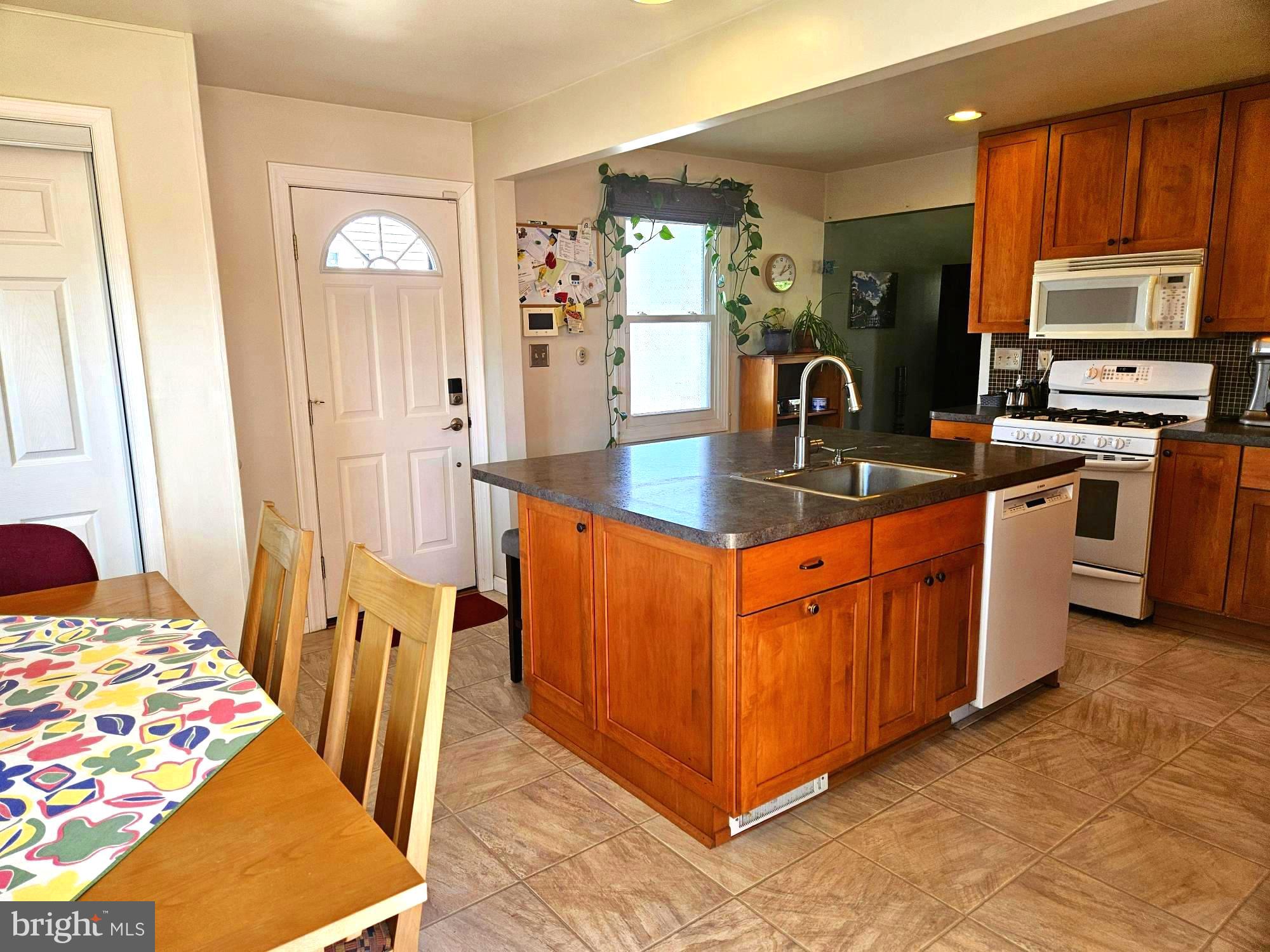 356 West Signal Hill Road King of Prussia, PA 19406 - Photo 10 of 28 a kitchen with stainless steel appliances granite countertop a sink and a refrigerator