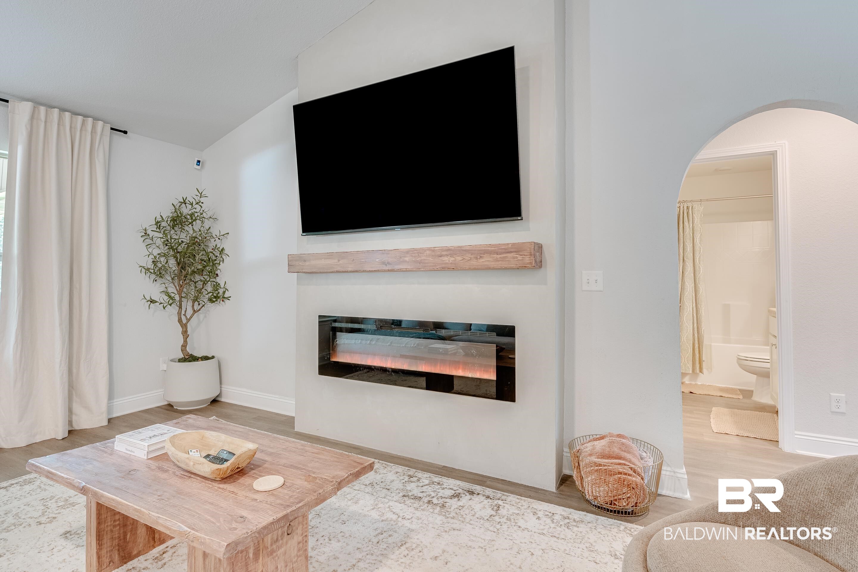 2215 Fernwood Loop West Semmes, AL 36575 - Photo 8 of 40 Integrated electric fireplace with wood-finish mantel and mounted display