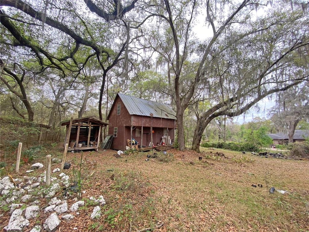 119 Twin Lakes Road Hawthorne, FL 32640 - Photo 24 of 66 a front view of a house with a yard