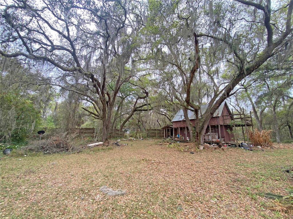 119 Twin Lakes Road Hawthorne, FL 32640 - Photo 25 of 66 a view of house with a yard