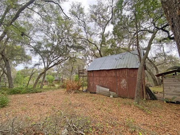 a backyard of a house with lots of green space