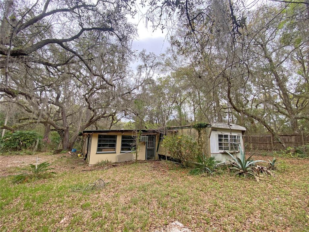 119 Twin Lakes Road Hawthorne, FL 32640 - Photo 40 of 66 front view of a house with a dry trees