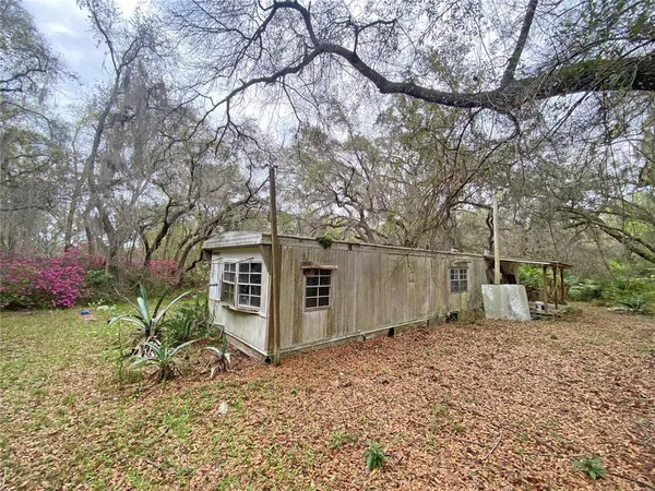 a room with furniture a window and gym equipment