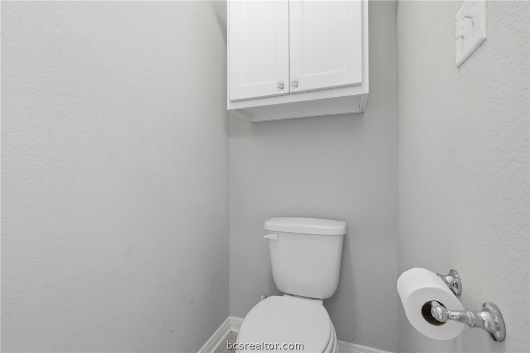 1922 Viva Road Bryan, TX 77807 - Photo 20 of 45 Well-appointed primary bathroom offers granite countertops, dual vanities, a soaking tub, and walk-in shower.