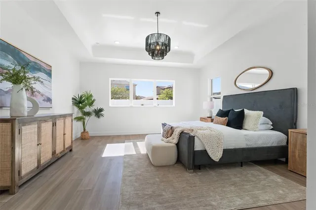 a living room with furniture and flowers