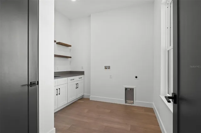 a view of swimming pool with outdoor seating and plants