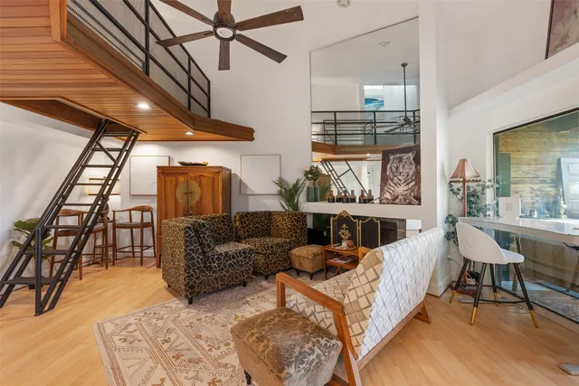 a living room with furniture a fireplace and a table
