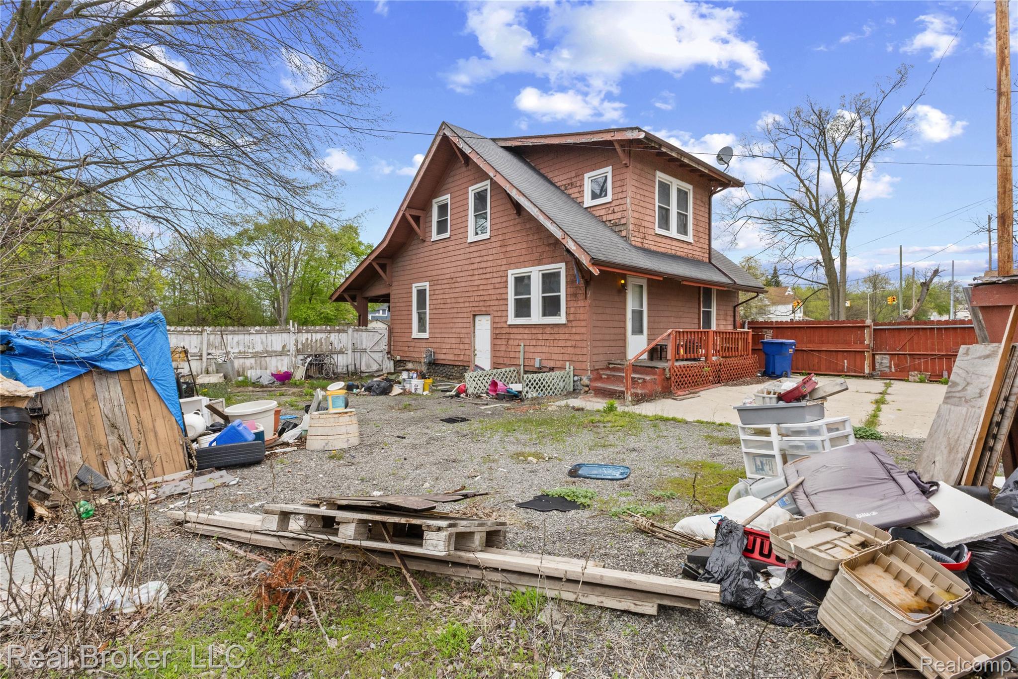 352 Perry Street Pontiac, MI 48342 - Photo 6 of 30 Rear view of property featuring a wooden deck, a fenced backyard, and roof with shingles