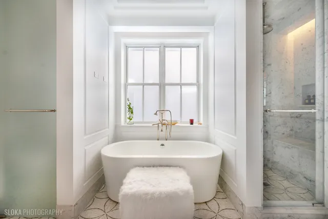 a lobby with furniture and a potted plant