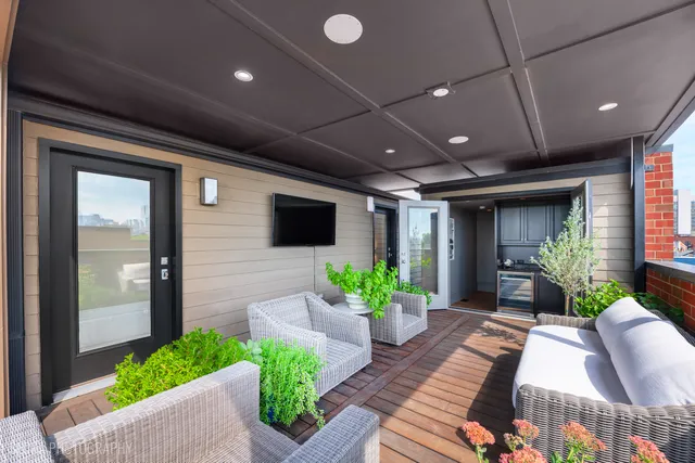 a kitchen with stainless steel appliances kitchen island granite countertop a sink and a stove