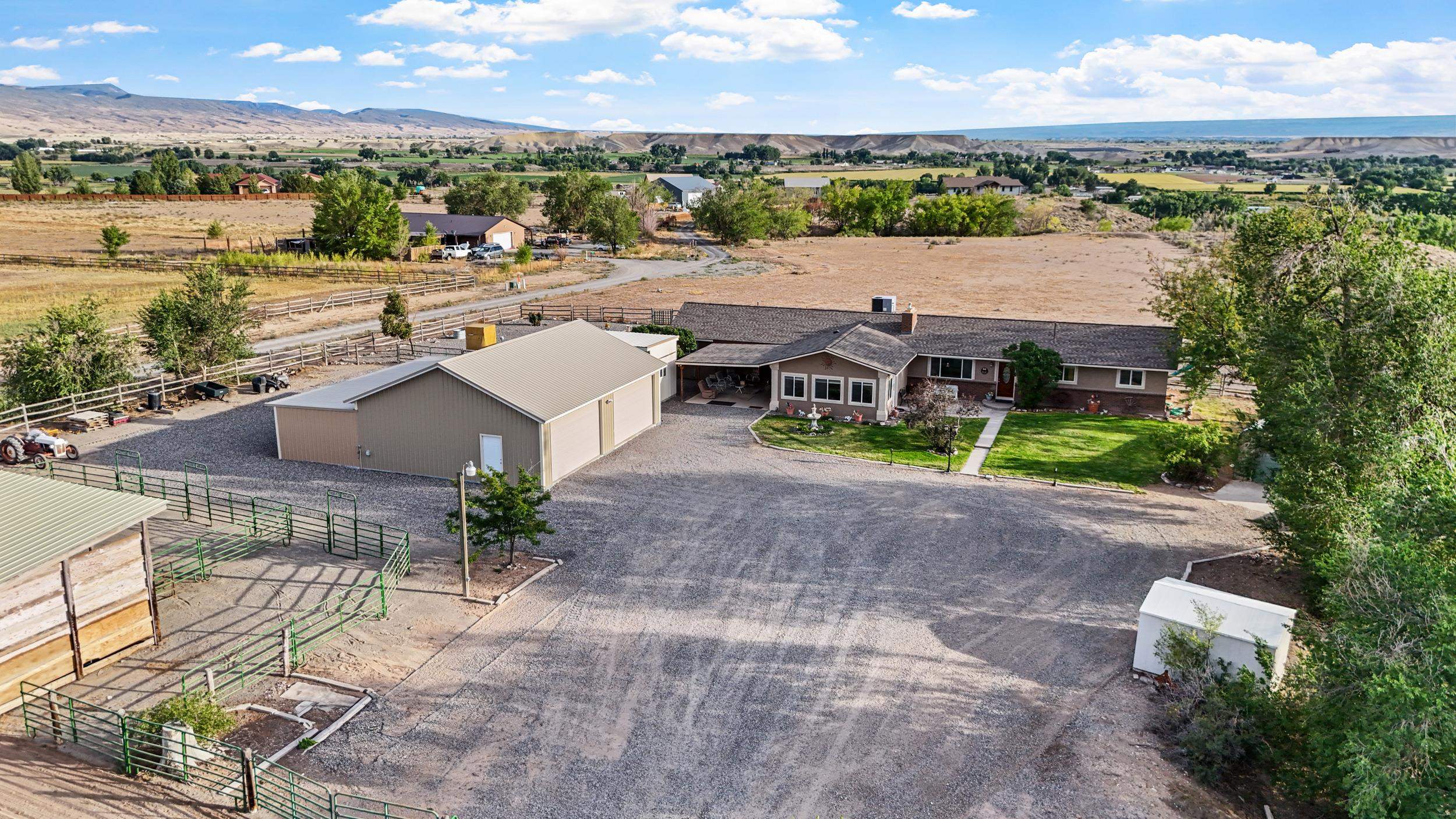 20786 Iris Road Austin, CO 81410 - Photo 35 of 38 an aerial view of a house with outdoor space lake view and mountain view