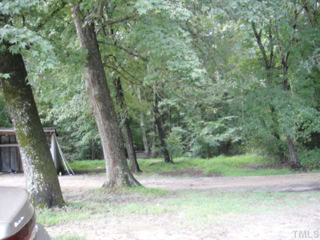 Napoleon Road Selma, NC 27576 - Photo 4 of 4 Parial view of lean-to on property as well as portion of rear of the property.