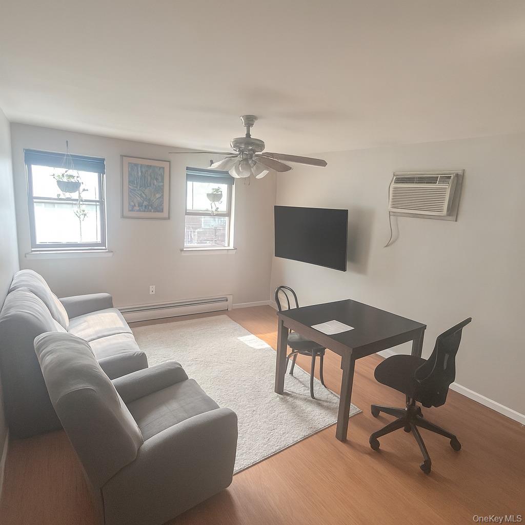 23 Reeve Place, Unit 2F Brooklyn, NY 11218 - Photo 1 of 1 a work room with furniture wooden floor and windows