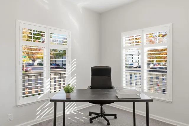 a view of a room with windows