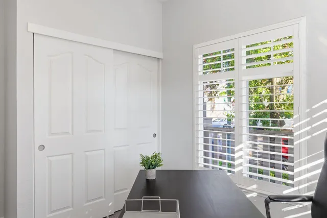 a view of a livingroom with furniture and dining table
